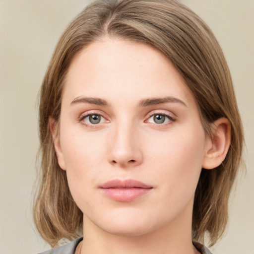 Neutral white young-adult female with medium  brown hair and green eyes