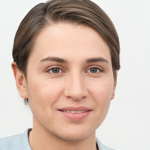 Joyful white young-adult female with short  brown hair and brown eyes