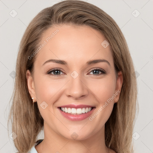 Joyful white young-adult female with long  brown hair and grey eyes