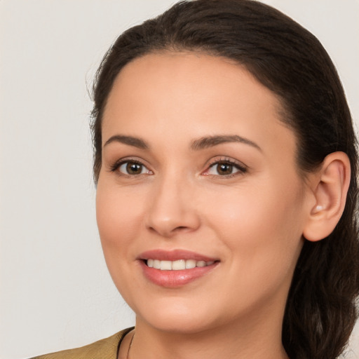 Joyful white young-adult female with medium  brown hair and brown eyes