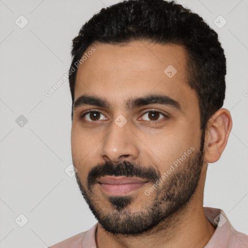 Joyful latino young-adult male with short  black hair and brown eyes