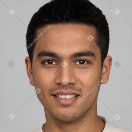 Joyful white young-adult male with short  black hair and brown eyes