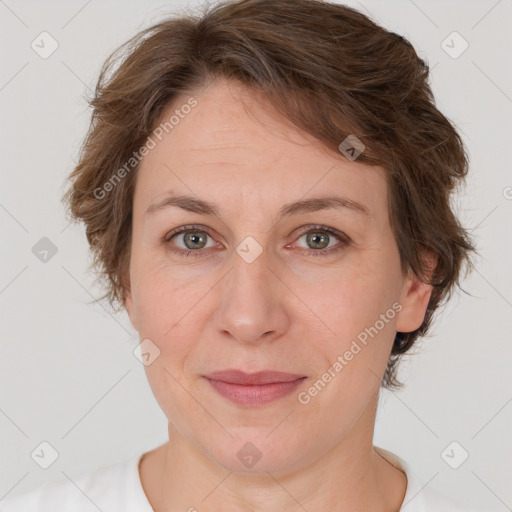 Joyful white adult female with short  brown hair and brown eyes