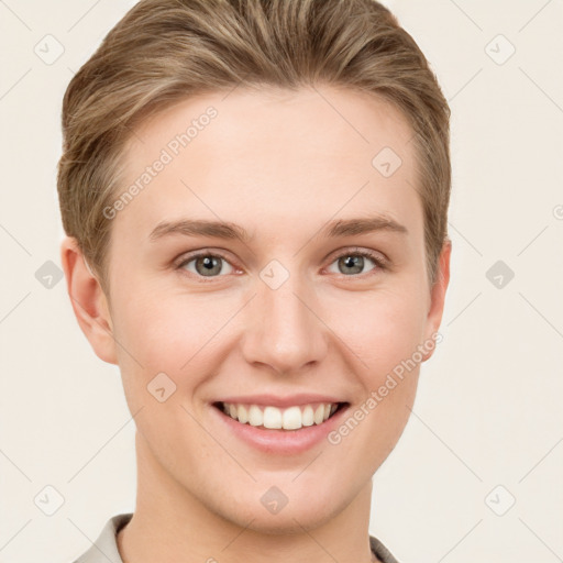 Joyful white young-adult female with short  brown hair and grey eyes