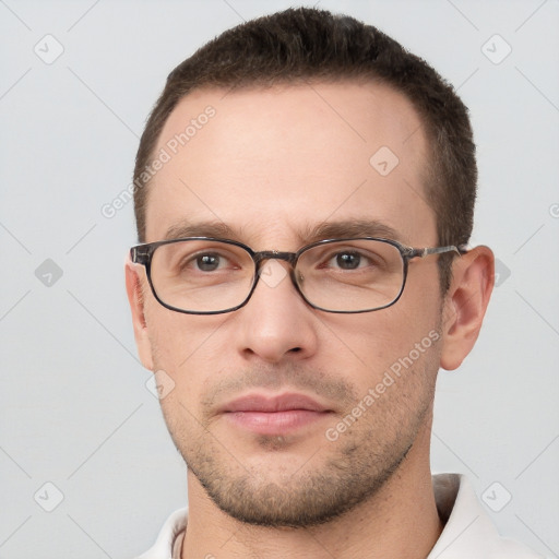 Neutral white young-adult male with short  brown hair and brown eyes