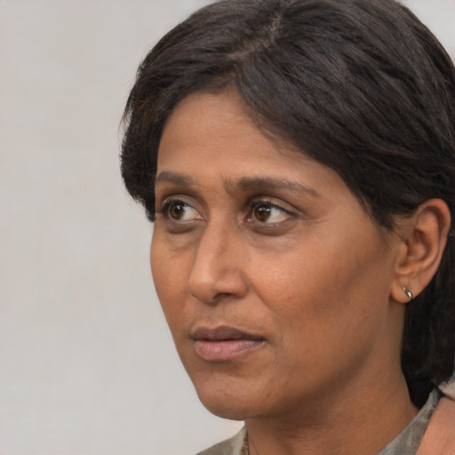 Neutral white adult female with short  brown hair and brown eyes