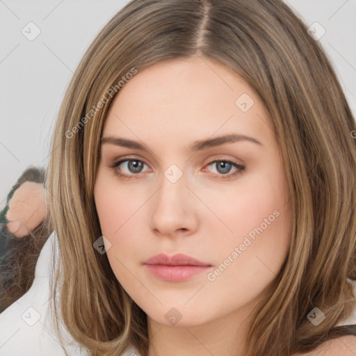 Neutral white young-adult female with long  brown hair and brown eyes