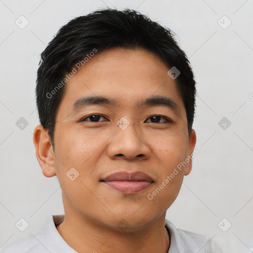 Joyful asian young-adult male with short  black hair and brown eyes