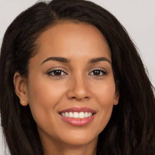 Joyful white young-adult female with long  brown hair and brown eyes