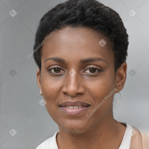 Joyful black young-adult female with short  black hair and brown eyes