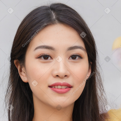 Joyful asian young-adult female with long  brown hair and brown eyes