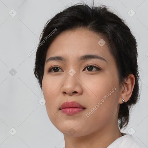 Neutral asian young-adult female with medium  brown hair and brown eyes