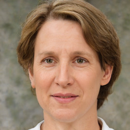 Joyful white adult female with medium  brown hair and grey eyes