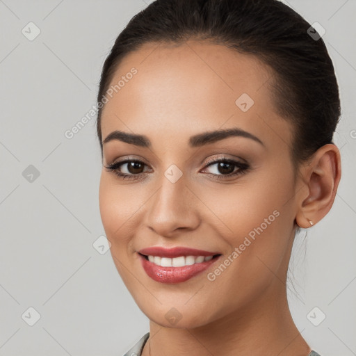 Joyful white young-adult female with long  brown hair and brown eyes