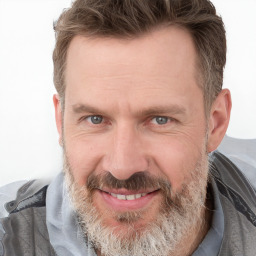 Joyful white adult male with short  brown hair and grey eyes