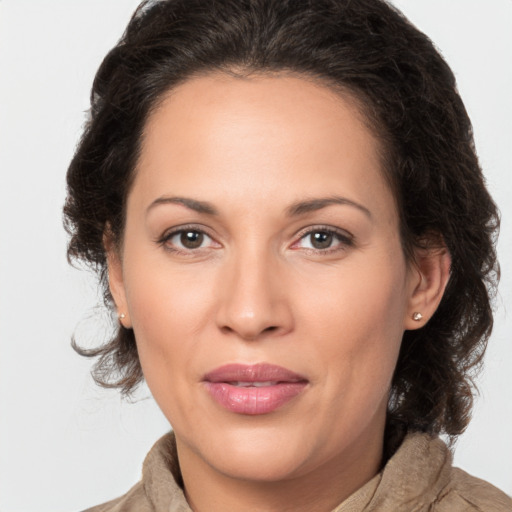 Joyful white adult female with medium  brown hair and brown eyes