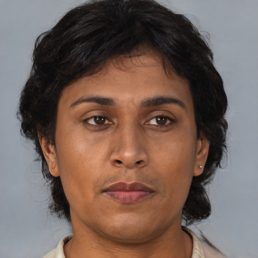Neutral asian adult female with medium  brown hair and brown eyes