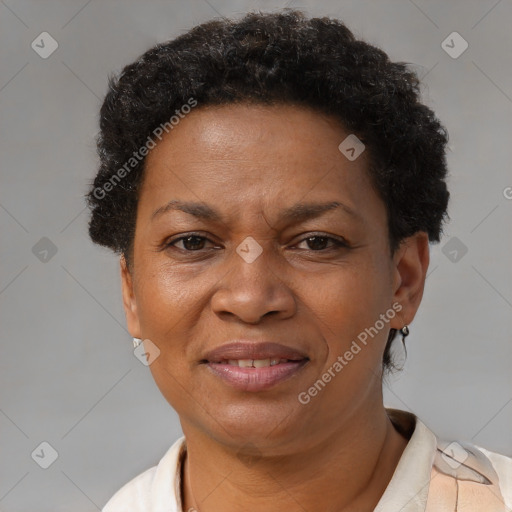 Joyful black adult female with short  brown hair and brown eyes