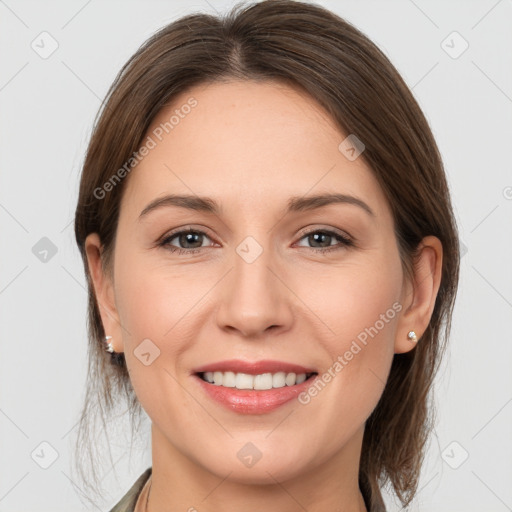 Joyful white young-adult female with medium  brown hair and grey eyes