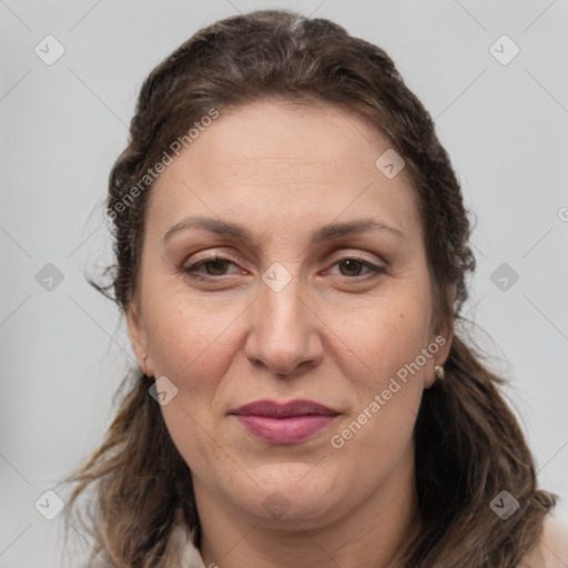 Joyful white adult female with medium  brown hair and grey eyes