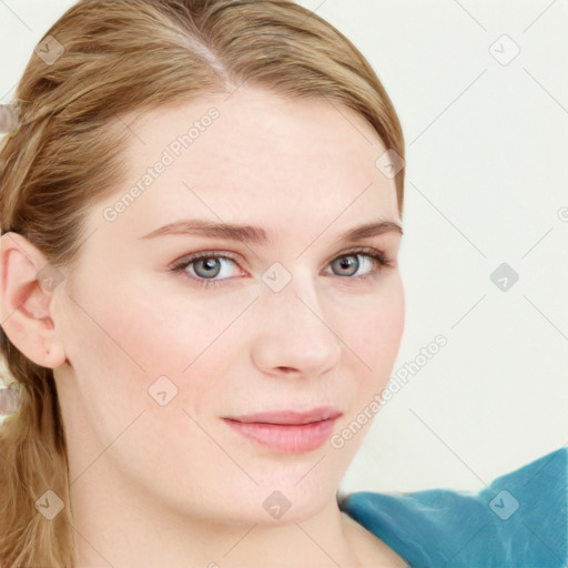 Joyful white young-adult female with long  brown hair and blue eyes