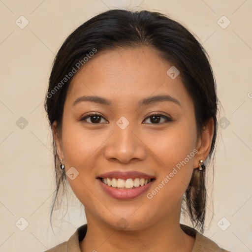 Joyful asian young-adult female with medium  brown hair and brown eyes