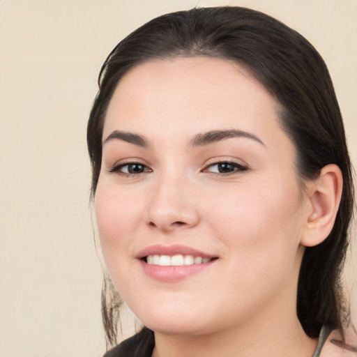 Joyful white young-adult female with medium  brown hair and brown eyes