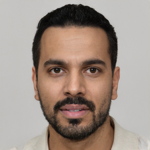 Neutral latino young-adult male with short  black hair and brown eyes