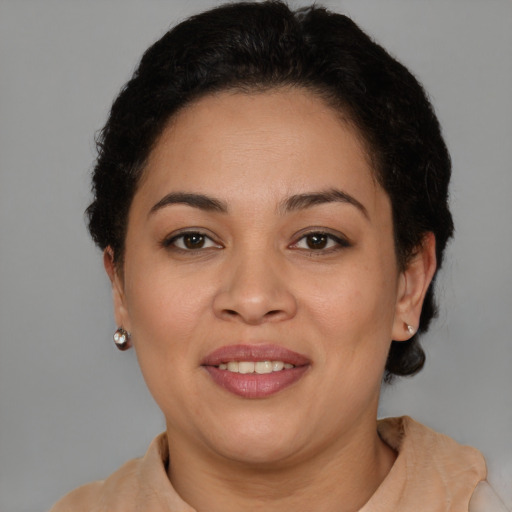 Joyful latino young-adult female with short  brown hair and brown eyes