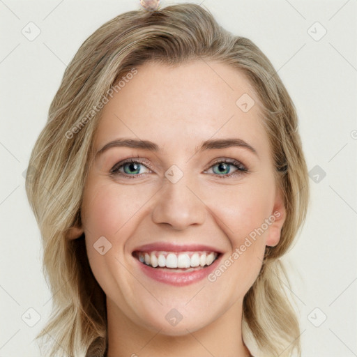 Joyful white young-adult female with long  brown hair and blue eyes