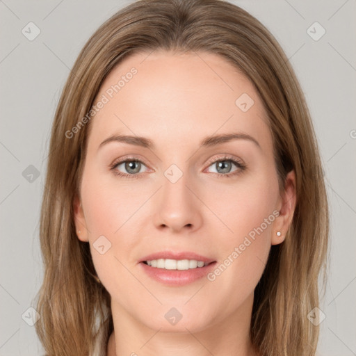 Joyful white young-adult female with long  brown hair and grey eyes