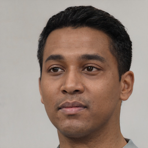 Neutral latino young-adult male with short  black hair and brown eyes