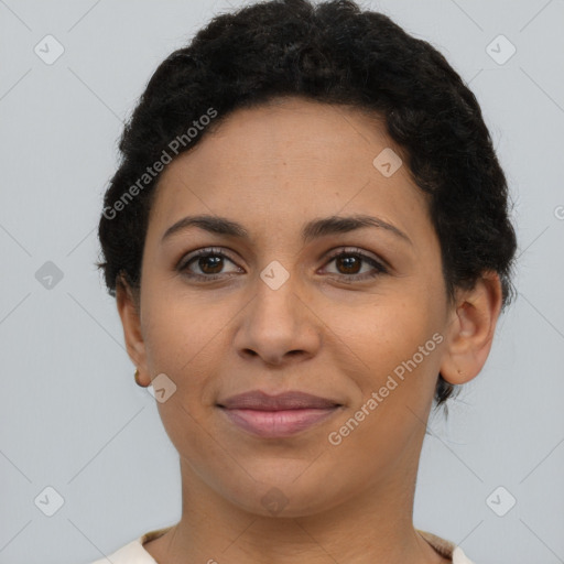 Joyful latino young-adult female with short  brown hair and brown eyes