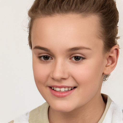 Joyful white child female with short  brown hair and brown eyes