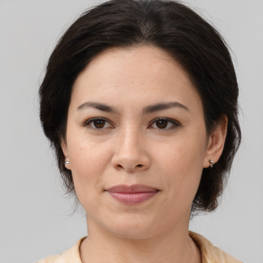 Joyful white young-adult female with medium  brown hair and brown eyes