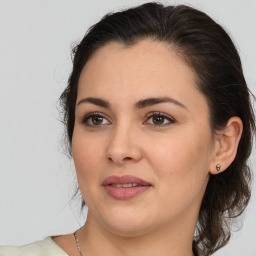 Joyful white young-adult female with medium  brown hair and brown eyes