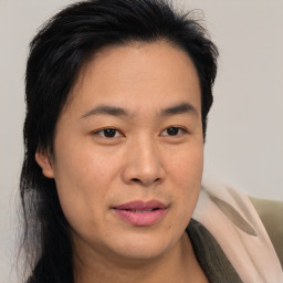 Joyful asian young-adult male with medium  brown hair and brown eyes