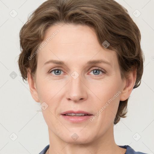 Joyful white adult female with short  brown hair and grey eyes