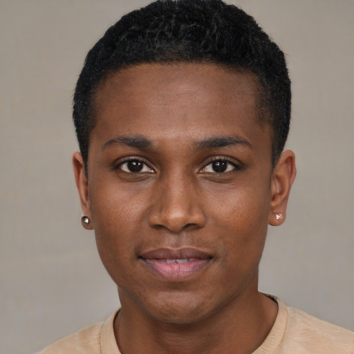 Joyful black young-adult male with short  black hair and brown eyes