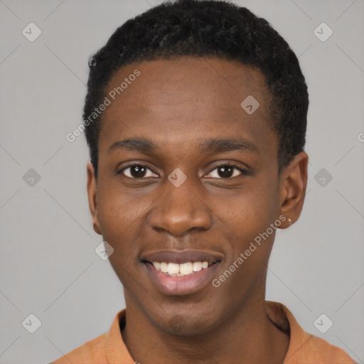Joyful black young-adult male with short  brown hair and brown eyes