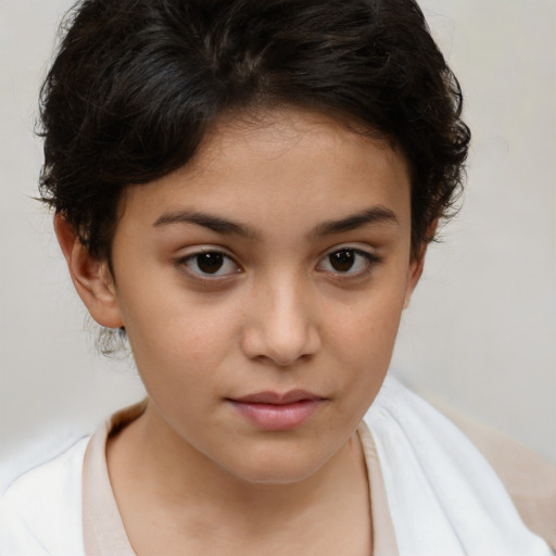 Joyful white child female with short  brown hair and brown eyes