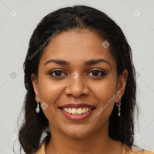 Joyful latino young-adult female with long  brown hair and brown eyes