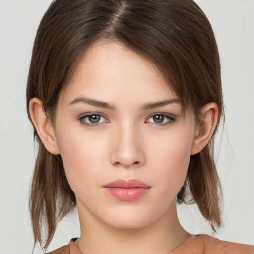 Neutral white young-adult female with medium  brown hair and brown eyes