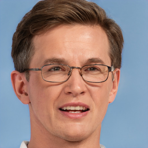 Joyful white adult male with short  brown hair and grey eyes