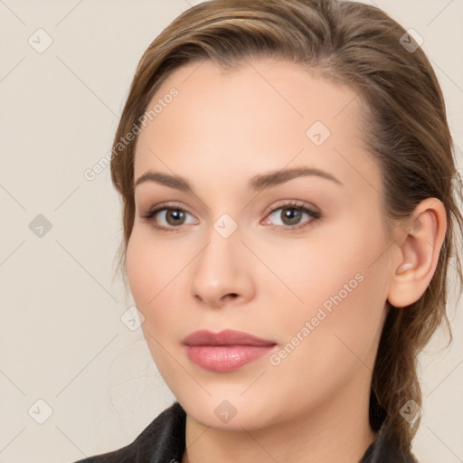 Neutral white young-adult female with long  brown hair and brown eyes