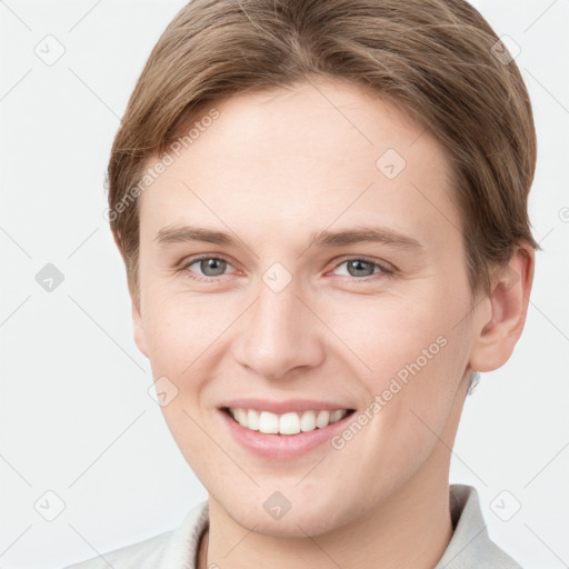 Joyful white young-adult female with short  brown hair and grey eyes