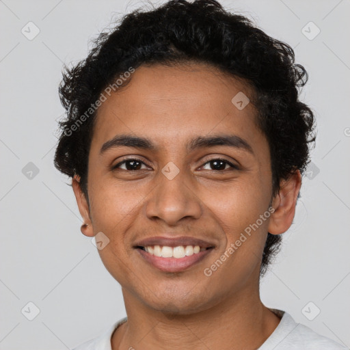 Joyful latino young-adult male with short  brown hair and brown eyes