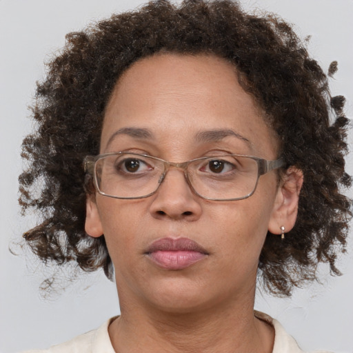 Neutral black adult female with short  brown hair and brown eyes