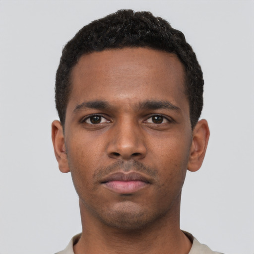 Neutral black young-adult male with short  black hair and brown eyes