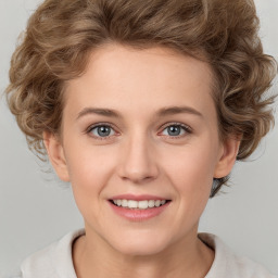 Joyful white young-adult female with medium  brown hair and blue eyes